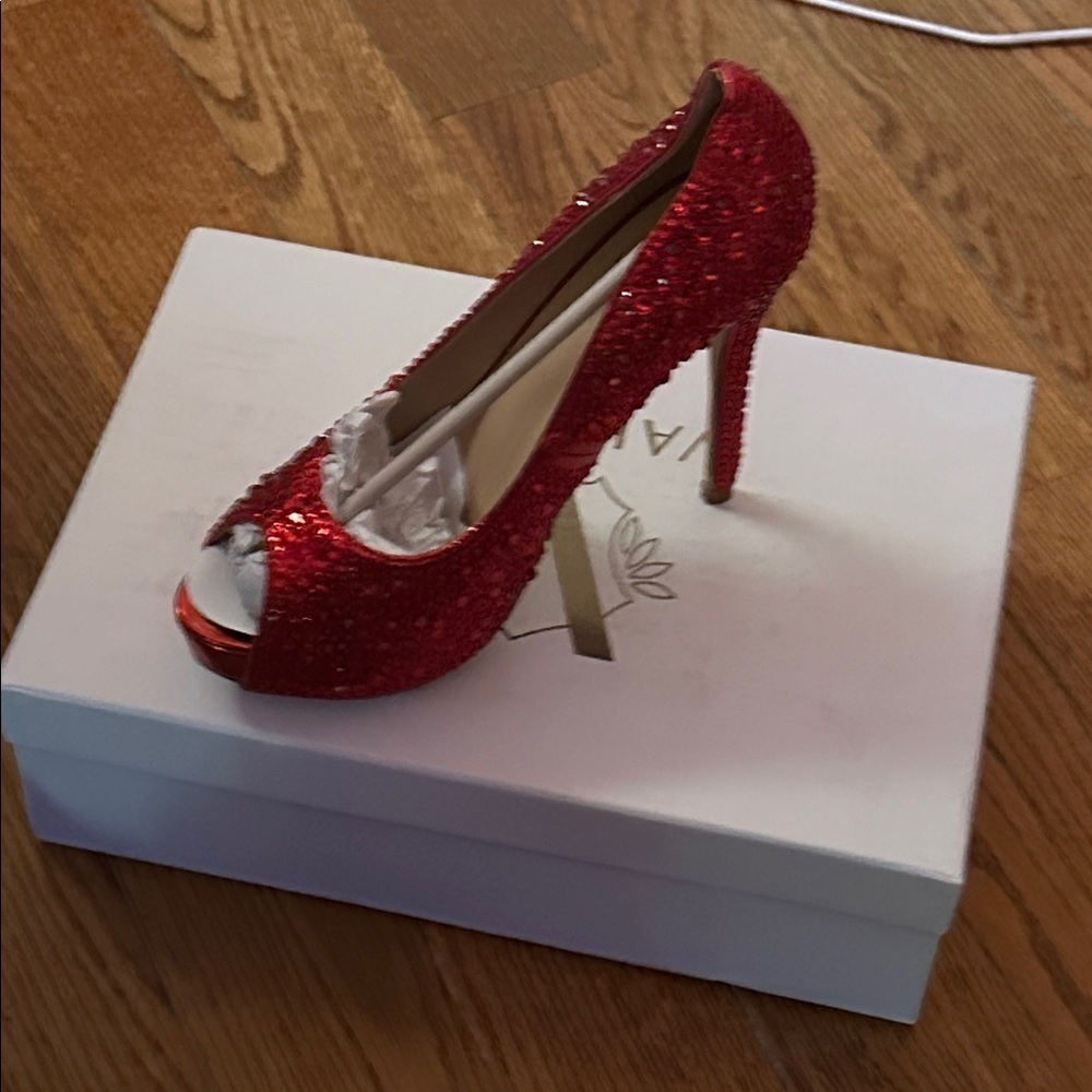 Valiant’s Celine Red Glitter Heels.